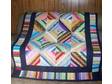 This multi-colored quilt is made using 1 1/2