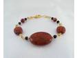 Red jasper accented with black glass beads and gold plated
